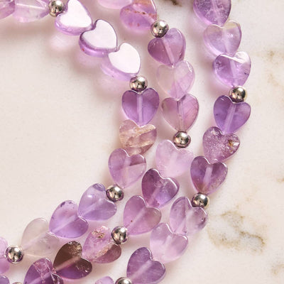 Amethyst | close-up of purple heart-shaped amethyst beads with silver round spacers, .925 sterling silver by NOGU