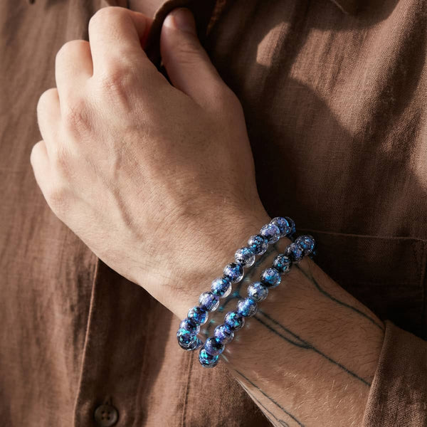 Blueberry Potion Firework Glass neon bracelet with shimmering blue-purple beads, styled as a double wrap on the wrist.