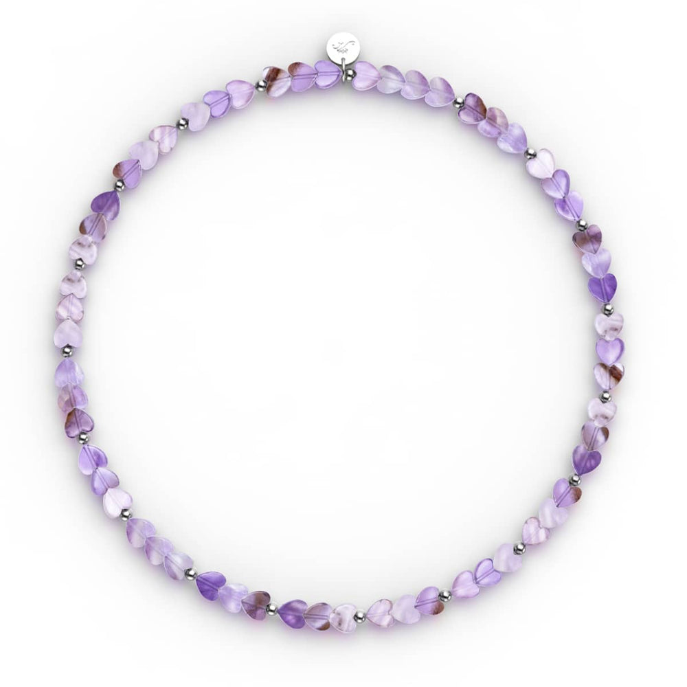 Amethyst | heart-shaped purple amethyst beads with silver spacers on stretch cord, .925 sterling silver charm by NOGU