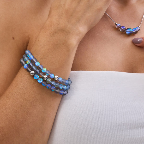 Grey Silver Mermaid Glass Bead Bracelet with iridescent beads and silver charms wrapped triple on wrist by NOGU